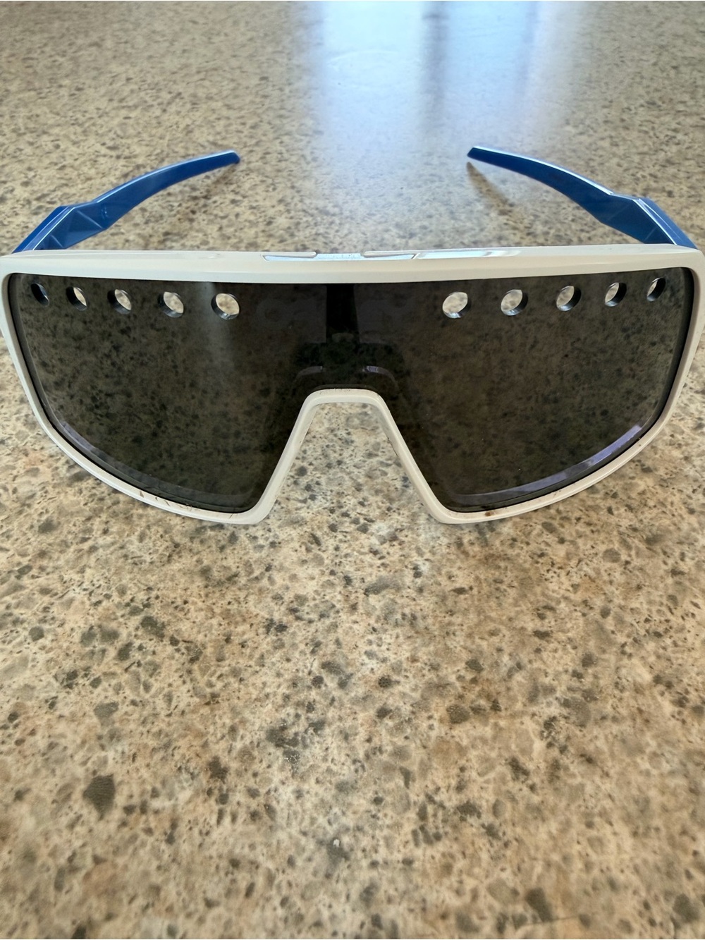 Oakley White Frame Sunglasses with Blue Temples and Dark Lens